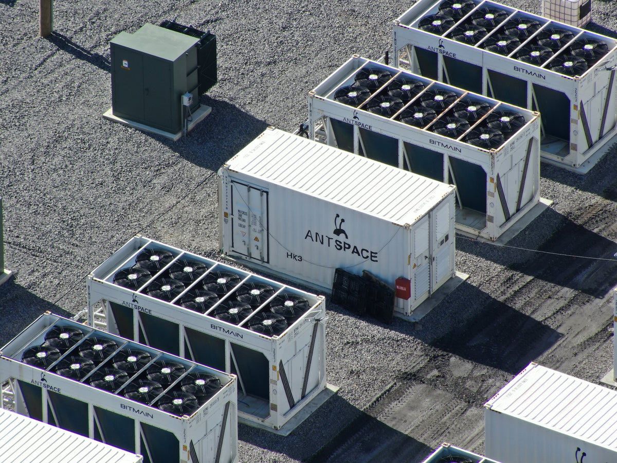 Aerial close-up of modular industrial cooling units and electrical equipment.